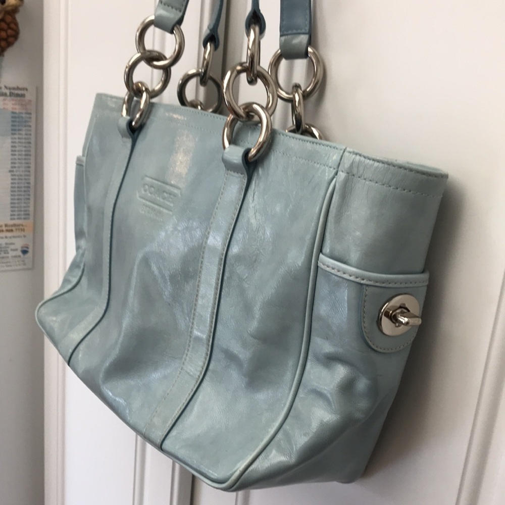 Coach handbag.  Light blue.  Silver rings and side trim.  Lots of pockets.